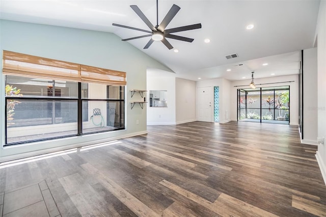 660 Channing Dr, Palm Harbor, FL 34684 - unfurnished living room with ceiling fan, lofted ceiling, wood finished floors, baseboards, and recessed lighting