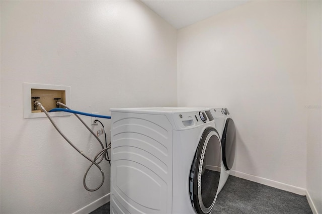 660 Channing Dr, Palm Harbor, FL 34684 - laundry area featuring baseboards, dark colored carpet, and separate washer and dryer