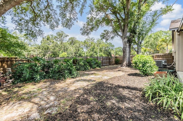 660 Channing Dr, Palm Harbor, FL 34684 - fenced backyard featuring central AC unit