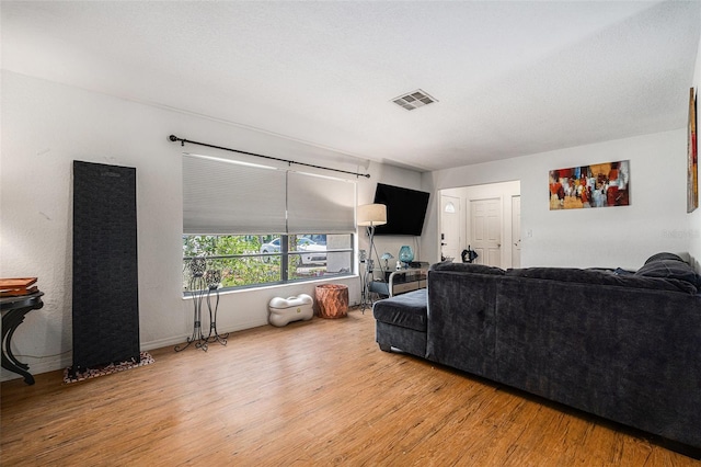 7700 Willow Brook Ct, Hudson, FL 34667 - living room featuring wood finished floors and baseboards