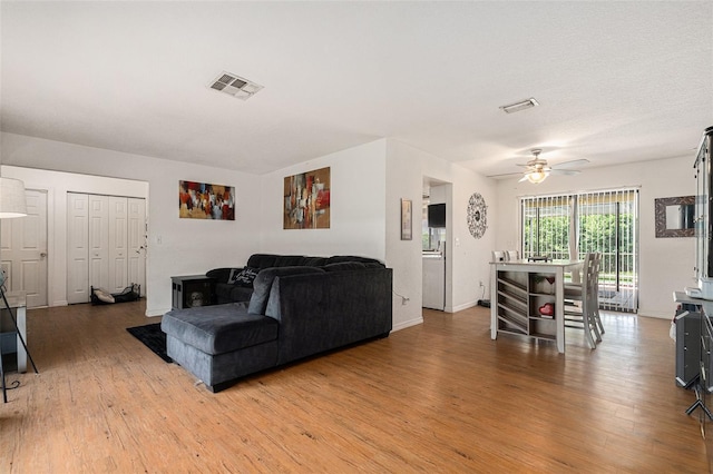7700 Willow Brook Ct, Hudson, FL 34667 - living area featuring light wood-type flooring and ceiling fan