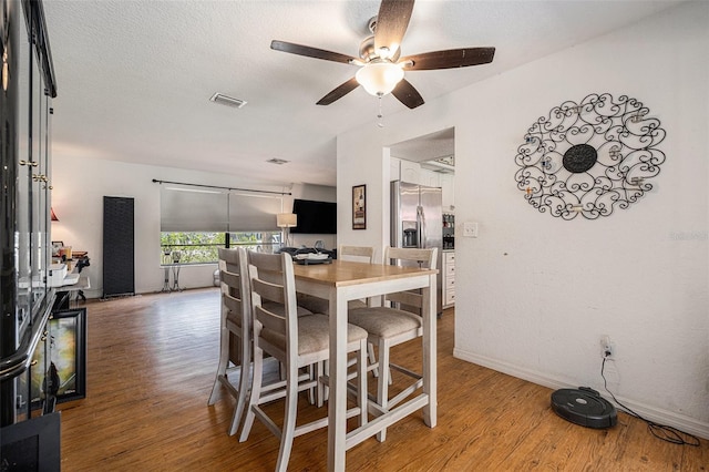 7700 Willow Brook Ct, Hudson, FL 34667 - dining space featuring ceiling fan and wood finished floors