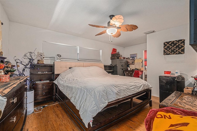 7700 Willow Brook Ct, Hudson, FL 34667 - bedroom with wood finished floors and a ceiling fan