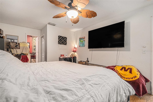 7700 Willow Brook Ct, Hudson, FL 34667 - bedroom with wood finished floors and ceiling fan