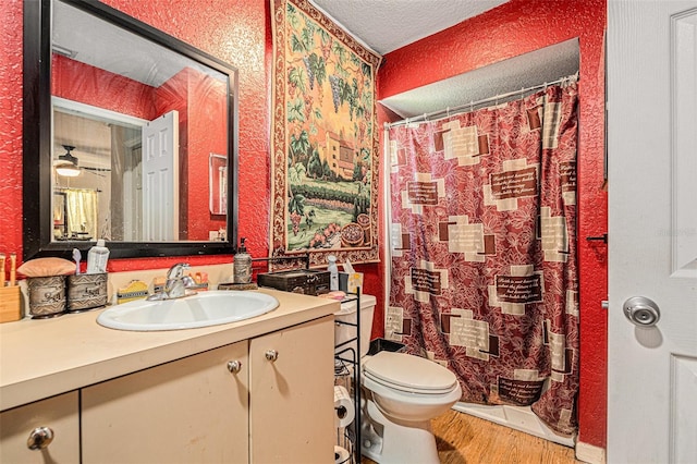 7700 Willow Brook Ct, Hudson, FL 34667 - full bath with wood finished floors, vanity, a textured ceiling, and a shower with curtain