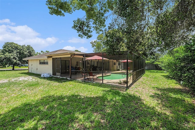 7700 Willow Brook Ct, Hudson, FL 34667 - rear view of property with a patio and glass enclosure