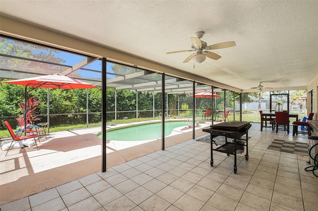 7700 Willow Brook Ct, Hudson, FL 34667 - sunroom / solarium with a ceiling fan, outdoor dining area, and a pool