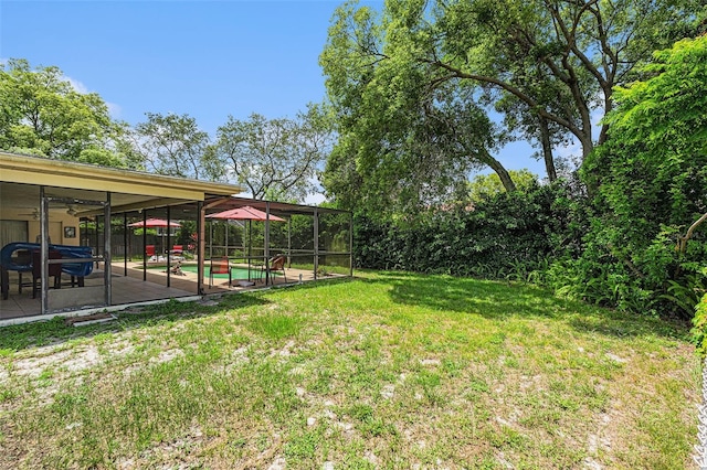 7700 Willow Brook Ct, Hudson, FL 34667 - view of grassy yard with an outdoor pool and a patio area