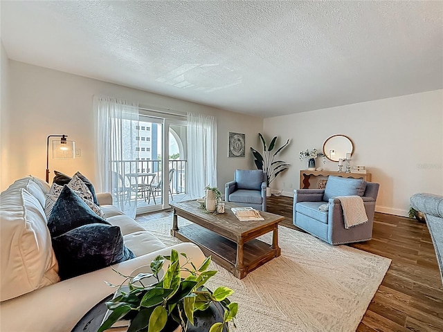 105 4th Ave NE Unit 426, Saint Petersburg, FL 33701 - living room featuring wood finished floors and a textured ceiling