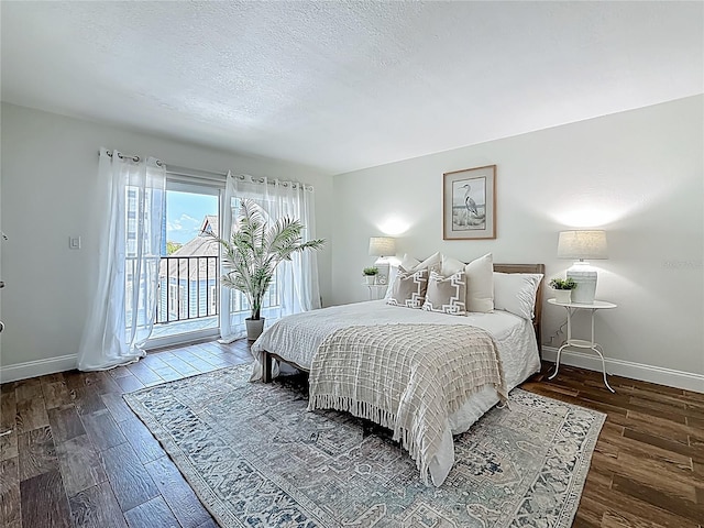 105 4th Ave NE Unit 426, Saint Petersburg, FL 33701 - bedroom with access to outside, wood finished floors, and a textured ceiling