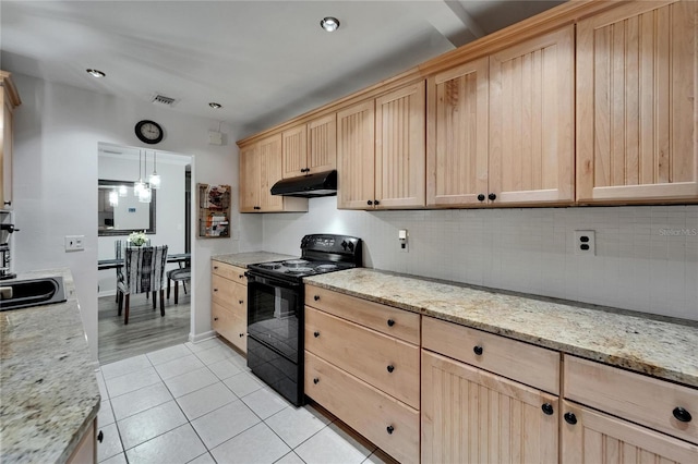 1813 Allegheny Dr, Sun City Center, FL 33573 - kitchen with black / electric stove, light brown cabinets, under cabinet range hood, decorative backsplash, and light tile patterned floors