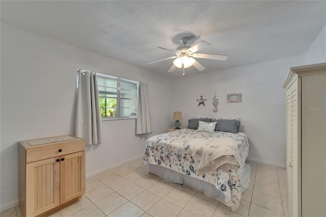 1813 Allegheny Dr, Sun City Center, FL 33573 - bedroom featuring light tile patterned flooring, baseboards, a textured ceiling, and ceiling fan