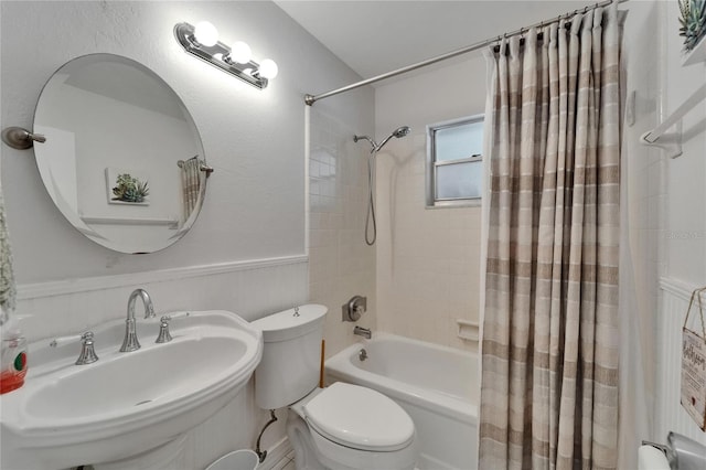 1813 Allegheny Dr, Sun City Center, FL 33573 - full bath with shower / bath combo, toilet, a sink, and wainscoting