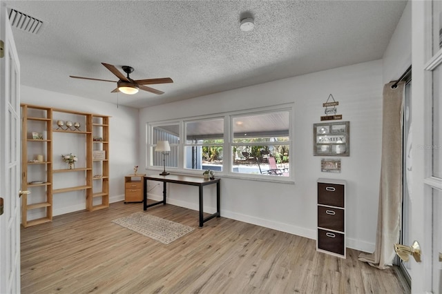 1813 Allegheny Dr, Sun City Center, FL 33573 - office space with ceiling fan, light wood finished floors, a textured ceiling, and baseboards