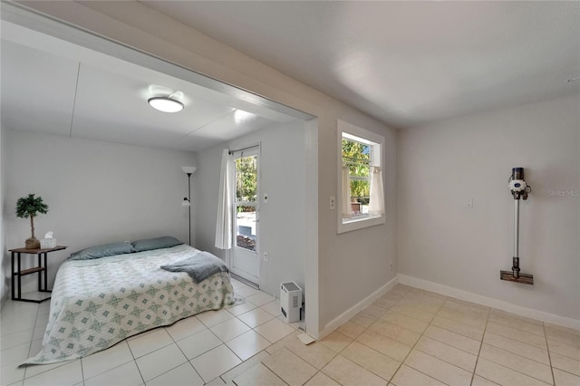 1813 Allegheny Dr, Sun City Center, FL 33573 - bedroom featuring light tile patterned floors and baseboards