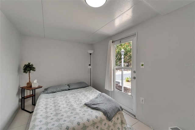 1813 Allegheny Dr, Sun City Center, FL 33573 - bedroom with light tile patterned floors