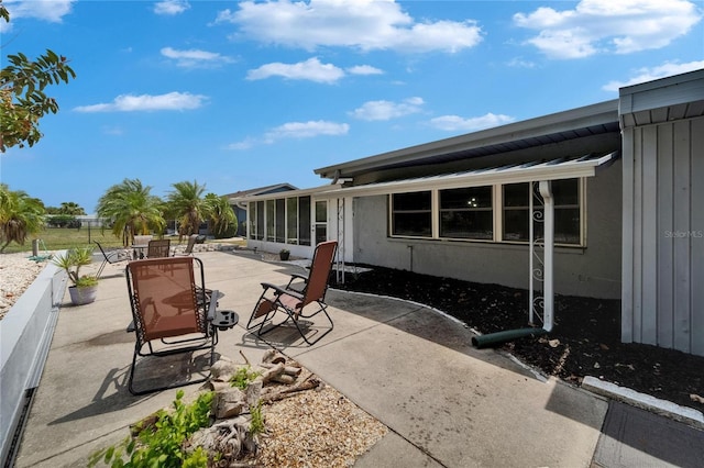 1813 Allegheny Dr, Sun City Center, FL 33573 - view of patio / terrace with a sunroom