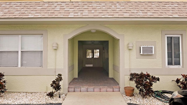 600 71st Ave Unit 16, St Pete Beach, FL 33706 - entrance to property featuring roof with shingles and stucco siding