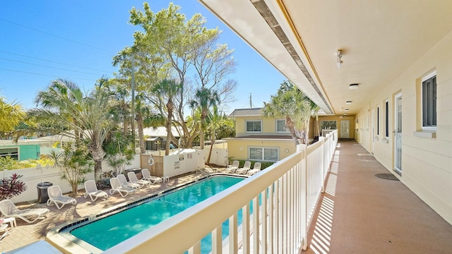 600 71st Ave Unit 16, St Pete Beach, FL 33706 - balcony with view of pool and a patio