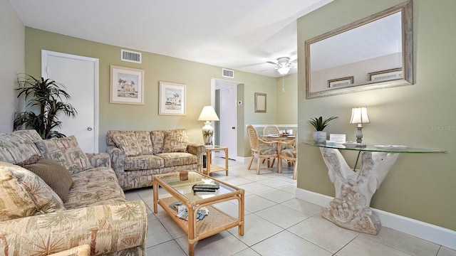 600 71st Ave Unit 16, St Pete Beach, FL 33706 - living area featuring a ceiling fan, light tile patterned flooring, and baseboards