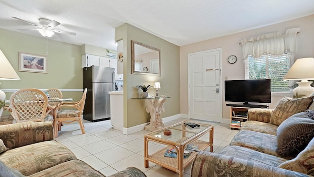 600 71st Ave Unit 16, St Pete Beach, FL 33706 - living area with light tile patterned floors, ceiling fan, and baseboards