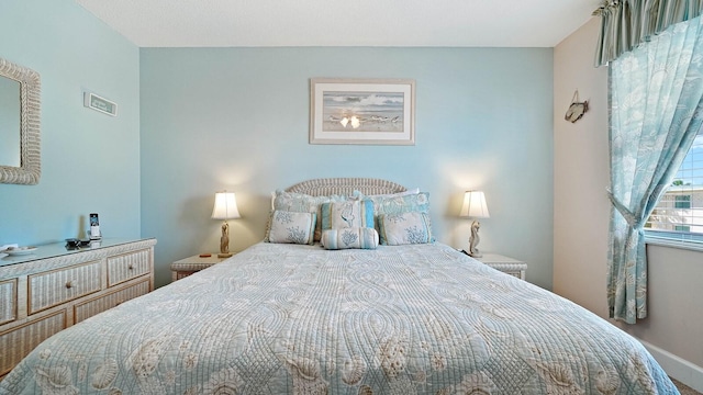 600 71st Ave Unit 16, St Pete Beach, FL 33706 - bedroom featuring baseboards