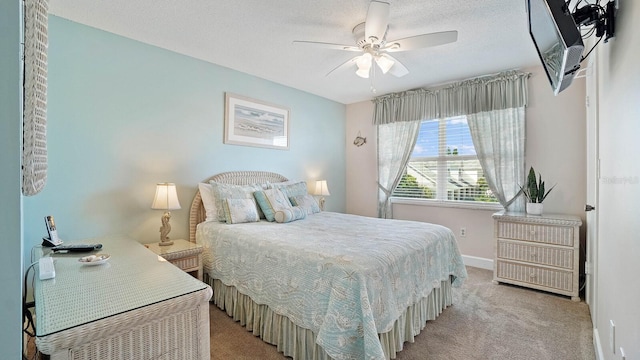 600 71st Ave Unit 16, St Pete Beach, FL 33706 - bedroom featuring light colored carpet, baseboards, an office area, and ceiling fan