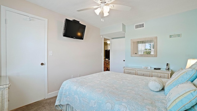 600 71st Ave Unit 16, St Pete Beach, FL 33706 - bedroom with carpet floors, ceiling fan, and baseboards