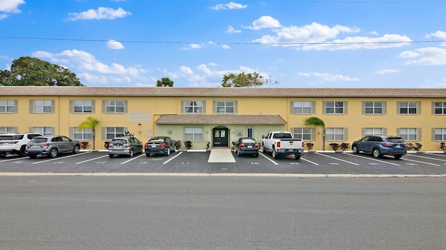 600 71st Ave Unit 16, St Pete Beach, FL 33706 - view of property featuring uncovered parking