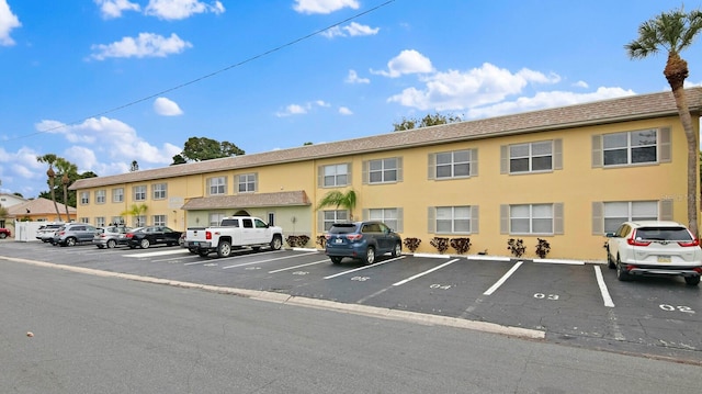 600 71st Ave Unit 16, St Pete Beach, FL 33706 - view of building exterior featuring uncovered parking
