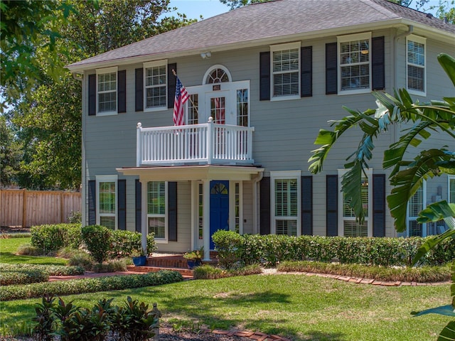 4611 Ackerly Way, Brandon, FL 33511 - view of front of property featuring a balcony and a shingled roof