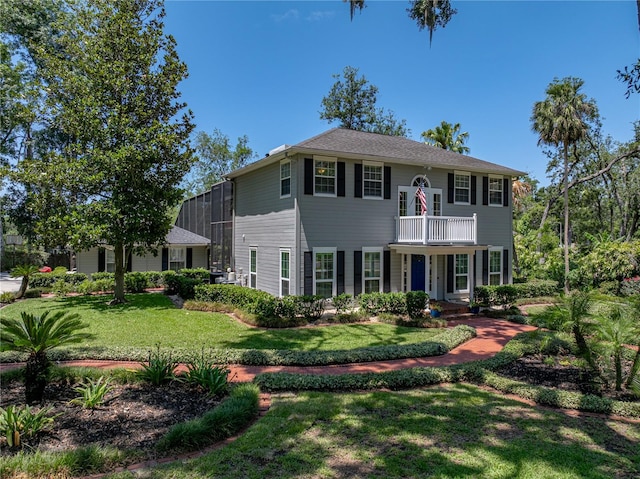 4611 Ackerly Way, Brandon, FL 33511 - view of front facade featuring a balcony and a front lawn