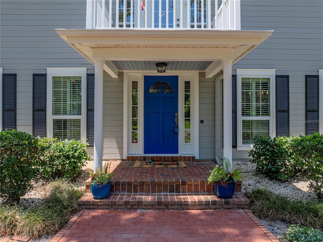 4611 Ackerly Way, Brandon, FL 33511 - doorway to property with a balcony and covered porch