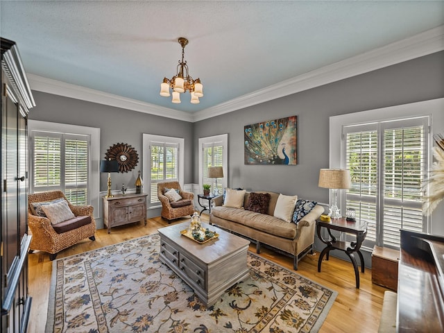 4611 Ackerly Way, Brandon, FL 33511 - living room with a chandelier, crown molding, plenty of natural light, and light wood-type flooring