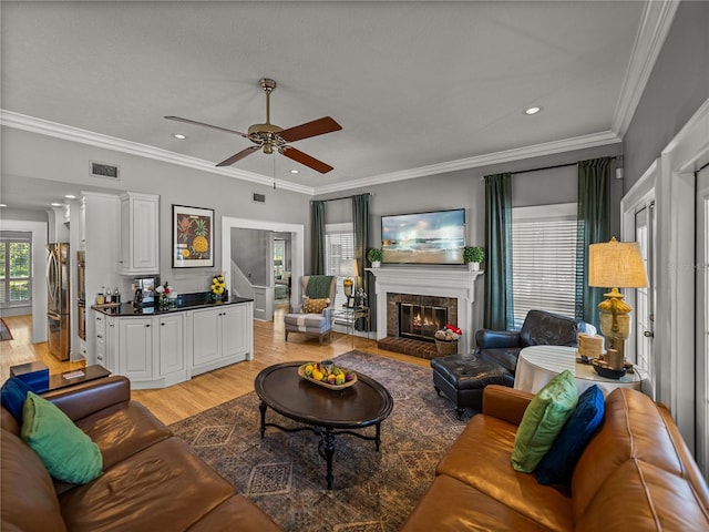 4611 Ackerly Way, Brandon, FL 33511 - living room featuring ceiling fan, light wood finished floors, a brick fireplace, ornamental molding, and recessed lighting