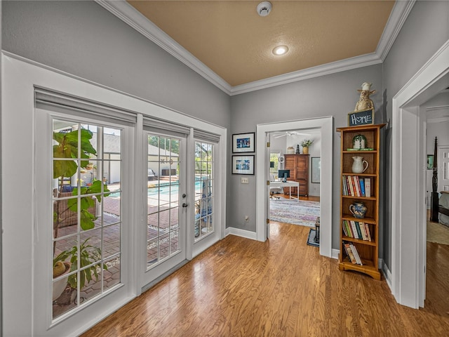 4611 Ackerly Way, Brandon, FL 33511 - entryway with french doors, crown molding, wood finished floors, a textured ceiling, and recessed lighting