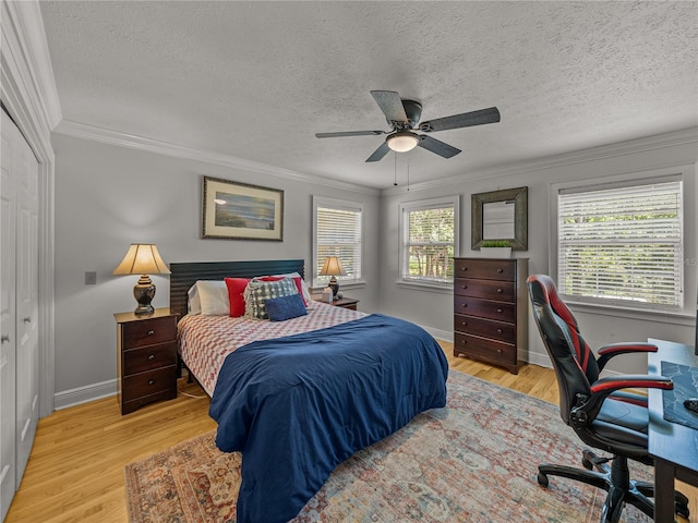 4611 Ackerly Way, Brandon, FL 33511 - bedroom featuring ornamental molding, an office area, light wood-style floors, a textured ceiling, and ceiling fan