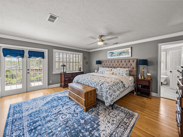 4611 Ackerly Way, Brandon, FL 33511 - bedroom featuring access to exterior, crown molding, wood finished floors, multiple windows, and french doors