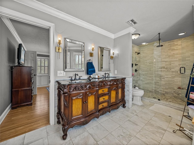 4611 Ackerly Way, Brandon, FL 33511 - full bath featuring a stall shower, crown molding, double vanity, a bidet, and tile patterned floors