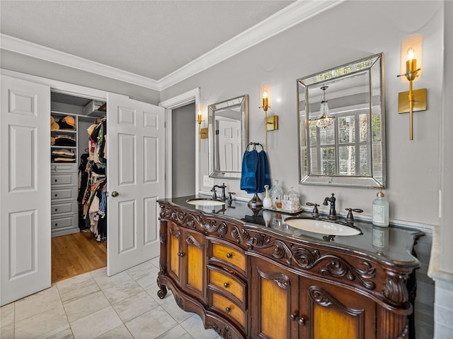4611 Ackerly Way, Brandon, FL 33511 - full bathroom featuring double vanity, crown molding, a spacious closet, and a chandelier