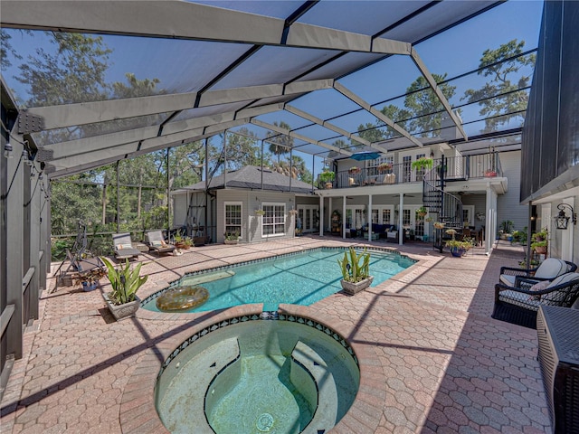 4611 Ackerly Way, Brandon, FL 33511 - view of swimming pool with a pool with connected hot tub, a patio, glass enclosure, and stairs