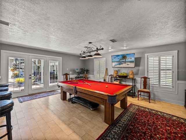 4611 Ackerly Way, Brandon, FL 33511 - recreation room with a textured ceiling, pool table, light wood-style floors, and french doors