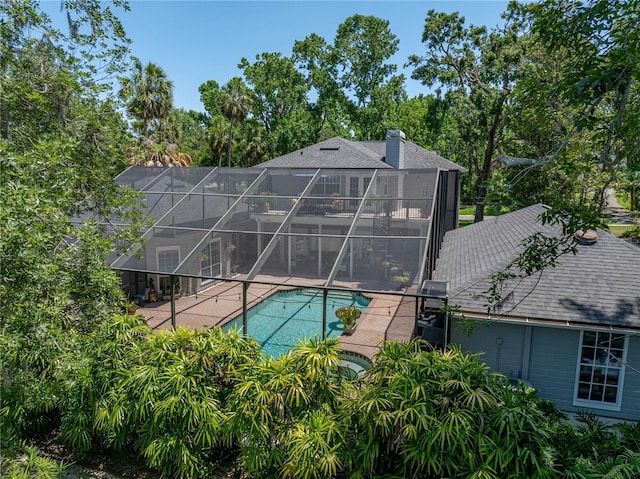 4611 Ackerly Way, Brandon, FL 33511 - swimming pool with a patio, a lanai, and view of scattered trees