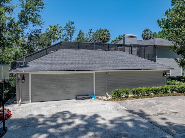 4611 Ackerly Way, Brandon, FL 33511 - view of side of home featuring roof with shingles and a chimney