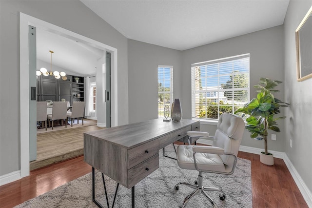 10421 Mesa Ln, Clermont, FL 34711 - office space featuring a chandelier, wood finished floors, baseboards, and vaulted ceiling
