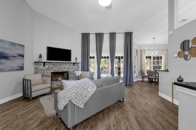 10421 Mesa Ln, Clermont, FL 34711 - living room featuring baseboards, wood finished floors, and a fireplace