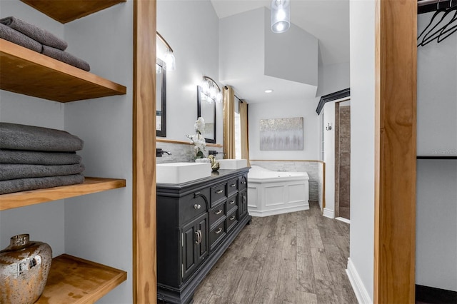 10421 Mesa Ln, Clermont, FL 34711 - full bathroom with wood finished floors, vanity, and a bath