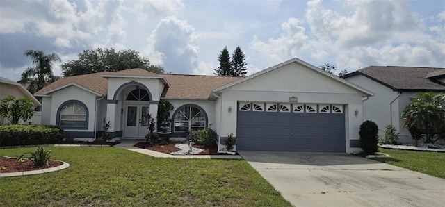 4500 Onorio St, New Port Richey, FL 34653 - view of front of property with a garage, stucco siding, a front yard, concrete driveway, and french doors