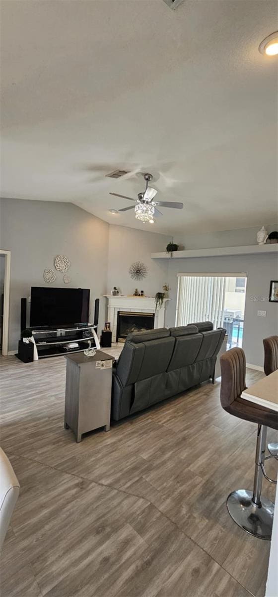 4500 Onorio St, New Port Richey, FL 34653 - living room with a ceiling fan and a fireplace