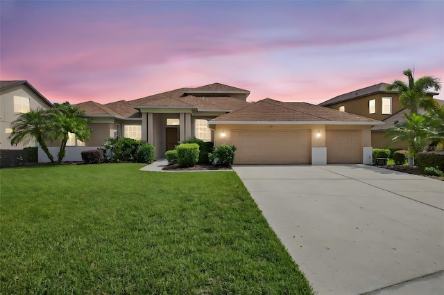 111 Falling Water Dr, Brandon, FL 33511 - view of front of home featuring an attached garage, stucco siding, concrete driveway, and a lawn
